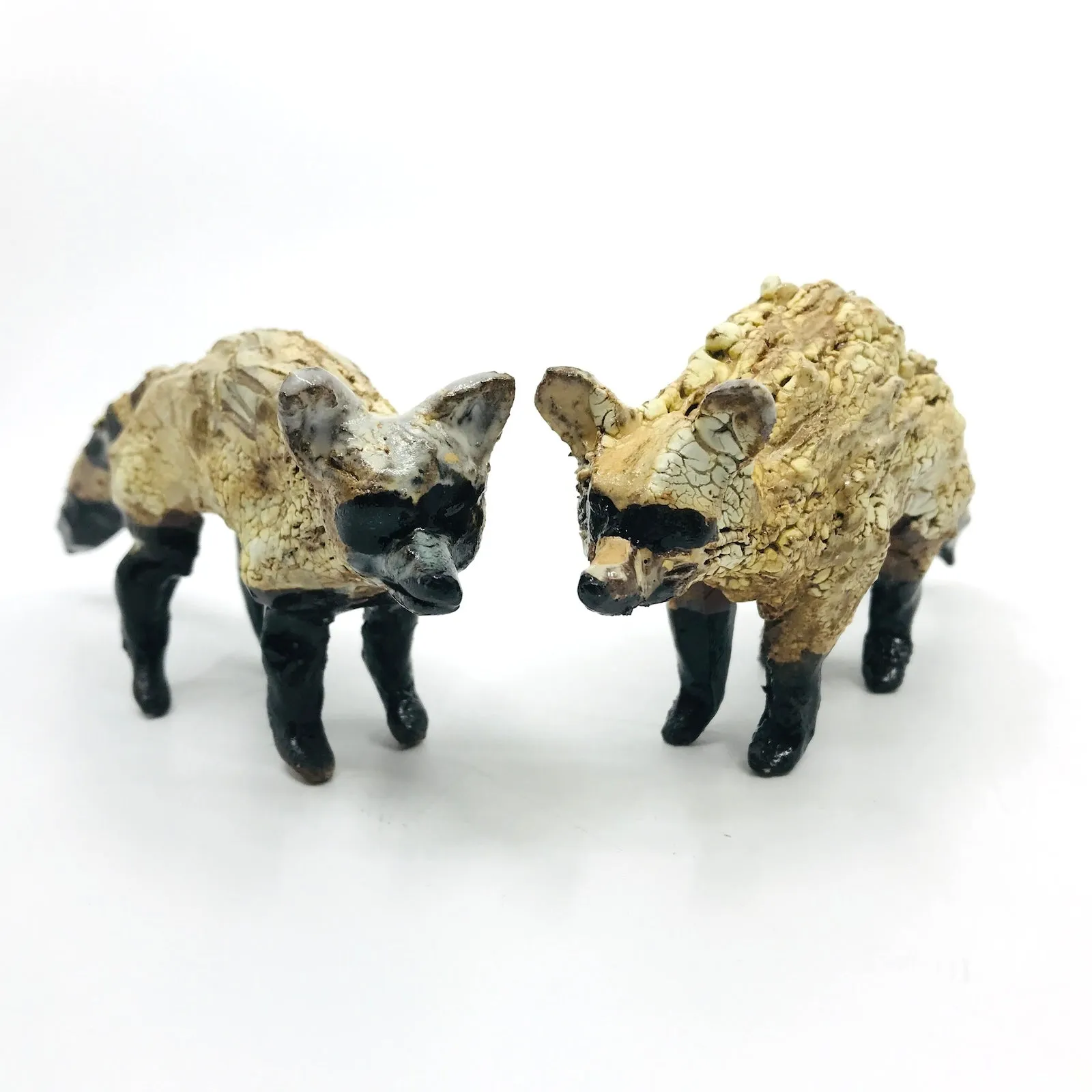 Raccoon Ceramic Sculptures by Erin Robertson