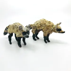 Raccoon Ceramic Sculptures by Erin Robertson