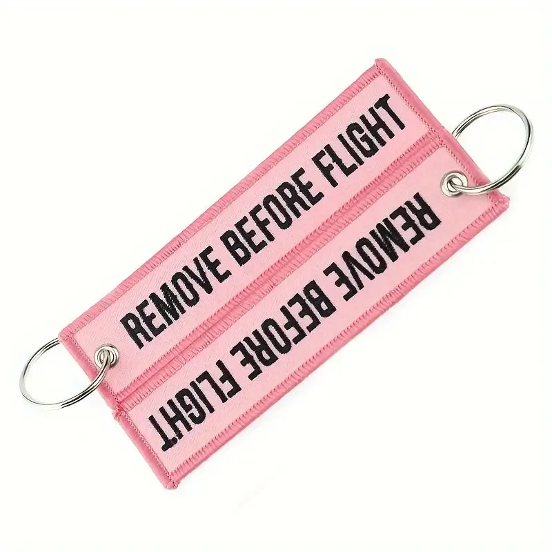 Remove Before Flight Pink Keychain